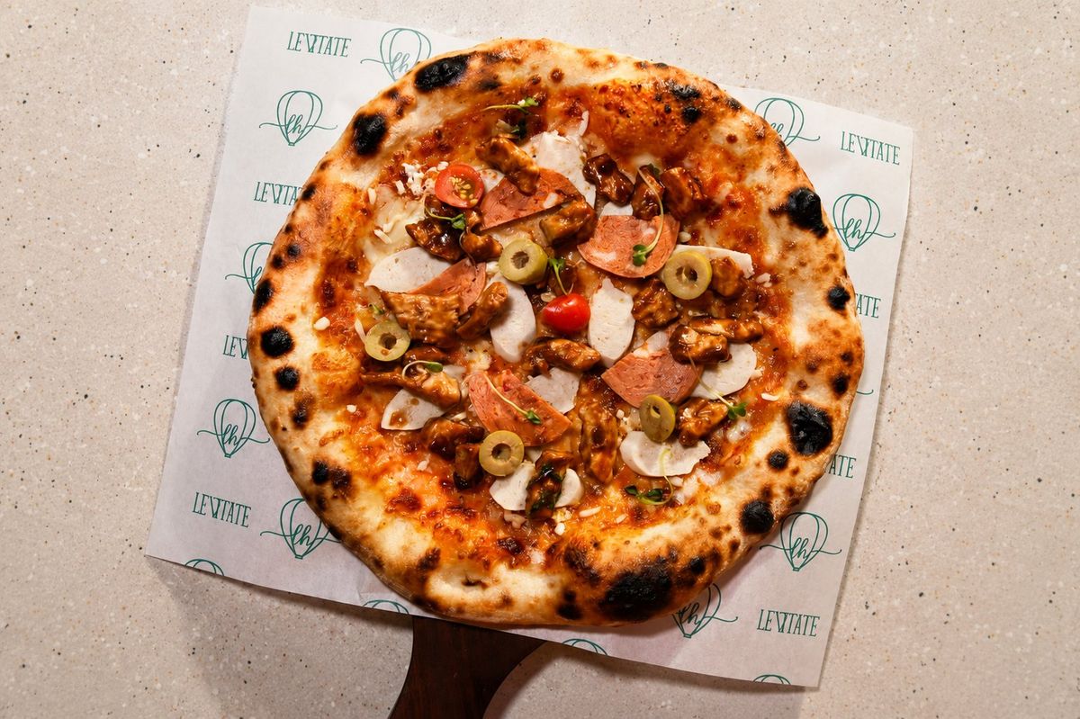 Meat Lovers Pizza — plated at Levitate