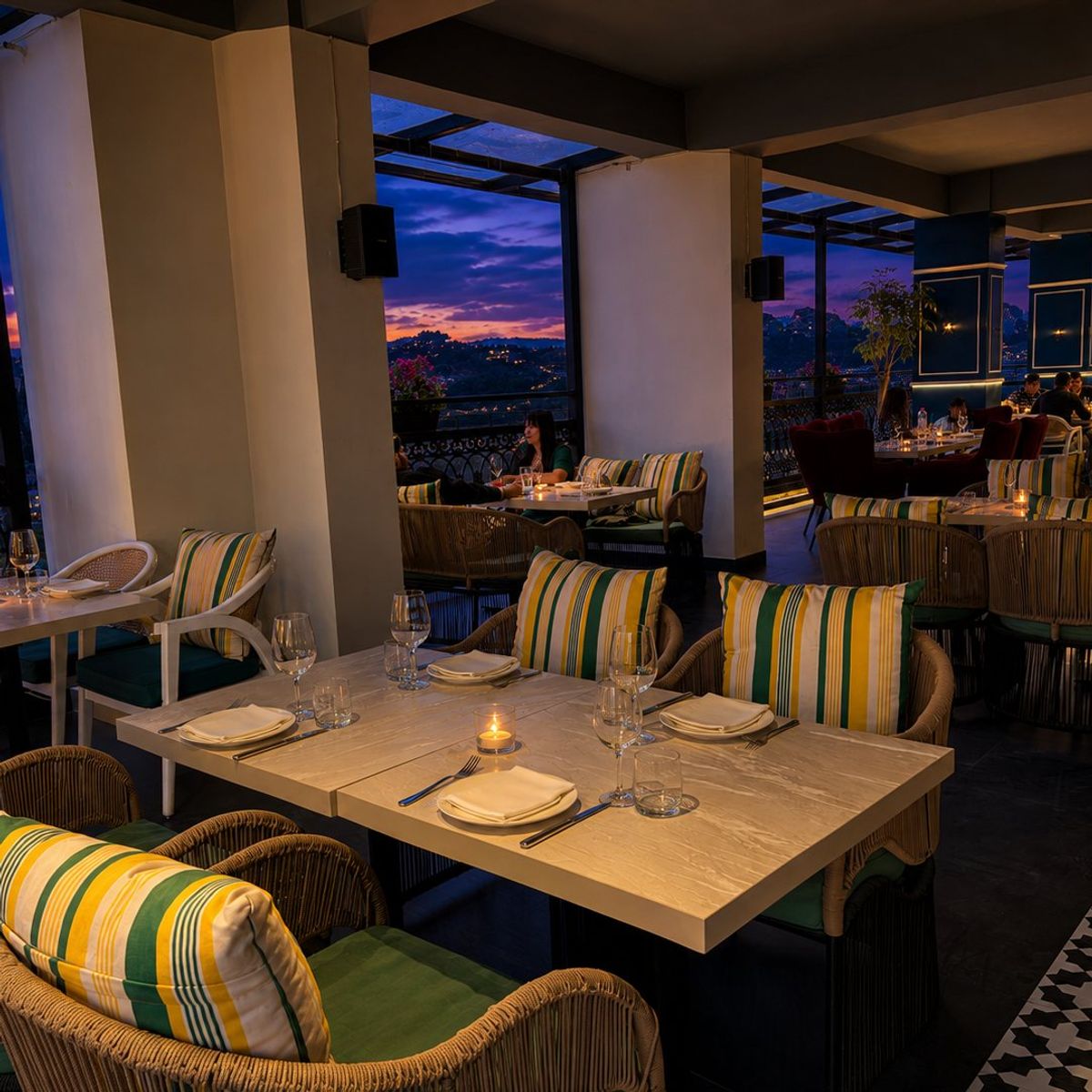 Rooftop tables set for sunset dining